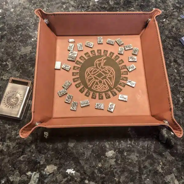 A leather tray with a tarot card on it. A leather tray with a tarot card on it.