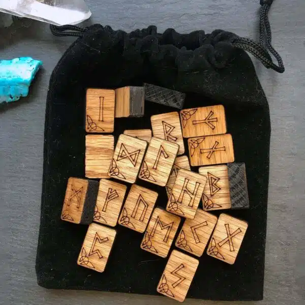A set of wooden letters in a black pouch. A set of wooden letters in a black pouch.