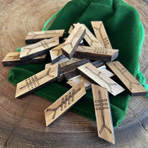 A group of wooden dominoes on top of a green bag.