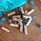 Wooden arrows and turquoise beads on a wooden board.