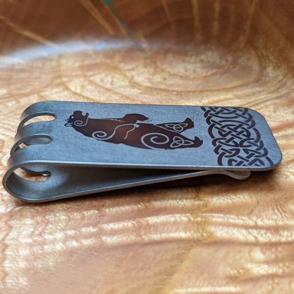 A money clip with an image of a bear on it.
