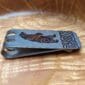 A money clip with an image of a bear on it.