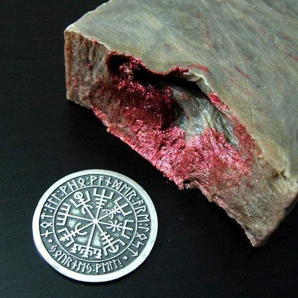 A piece of paper with a red mark on it.