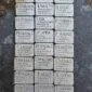 A group of Gather Rune Set 24pc Elder Futhark Pewter with different names on them.