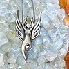 An Air Elemental Necklace on a bed of crystals.