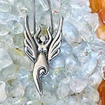 An Air Elemental Necklace on a bed of crystals.
