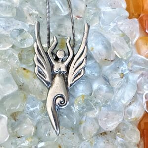 An Air Elemental Necklace on a bed of crystals.