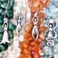 A group of Earth Elemental necklaces with stones and crystals.