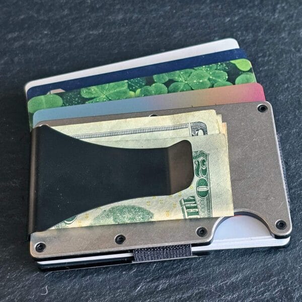 A Celtic Bear Titanium Minimalist Wallet with a shamrock on it.