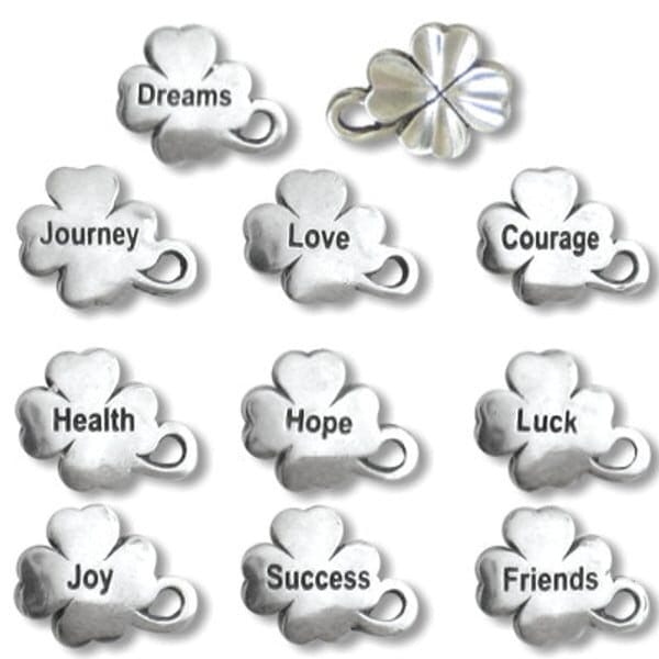 The "Bits of Luck Holiday Limited Edition" includes nine silver four leaf clover charms inscribed with Dreams, Journey, Love, Courage, Health, Hope, Luck, Joy, Success, Friends plus an additional plain clover charm.
