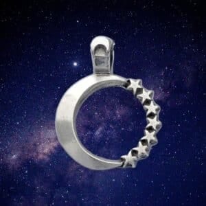 Moon & Stars Pendant featuring a silver crescent moon and stars set against a starry night sky backdrop.
