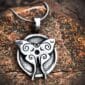 LunaMoth pendant against a wood background