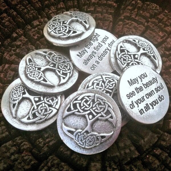 A 36 piece pack of Tree of Life Blessing Charms featuring Celtic knot designs and engraved inspirational quotes, displayed on a textured dark surface.