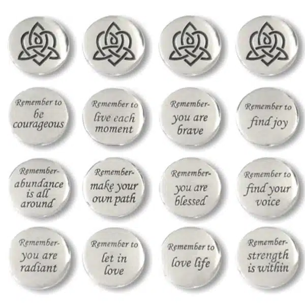 Brigid’s Heart Blessing Charms – 36 pc pack Thirty six Brigid's Heart Blessing Charms, featuring round silver tokens with Celtic knot designs and positive affirmations like โRemember to be courageousโ and โStrength is within.โ.